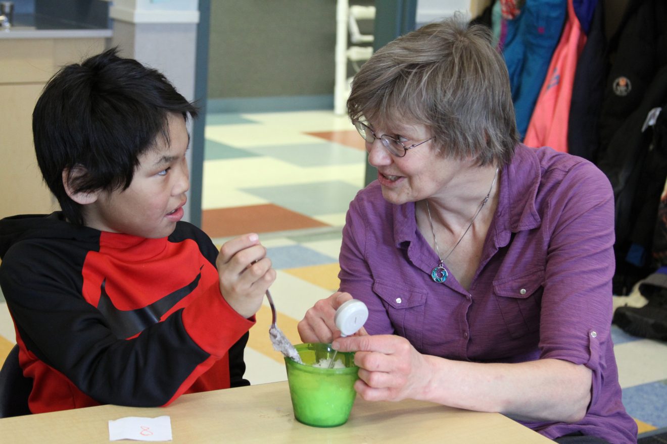 Yuri Bult-Ito photoUAF glaciologist Regine Hock helps a student investigate the effects of salt on the temperature of snow during a school visit, which was part of K-12 Outreach's place-based education approach.