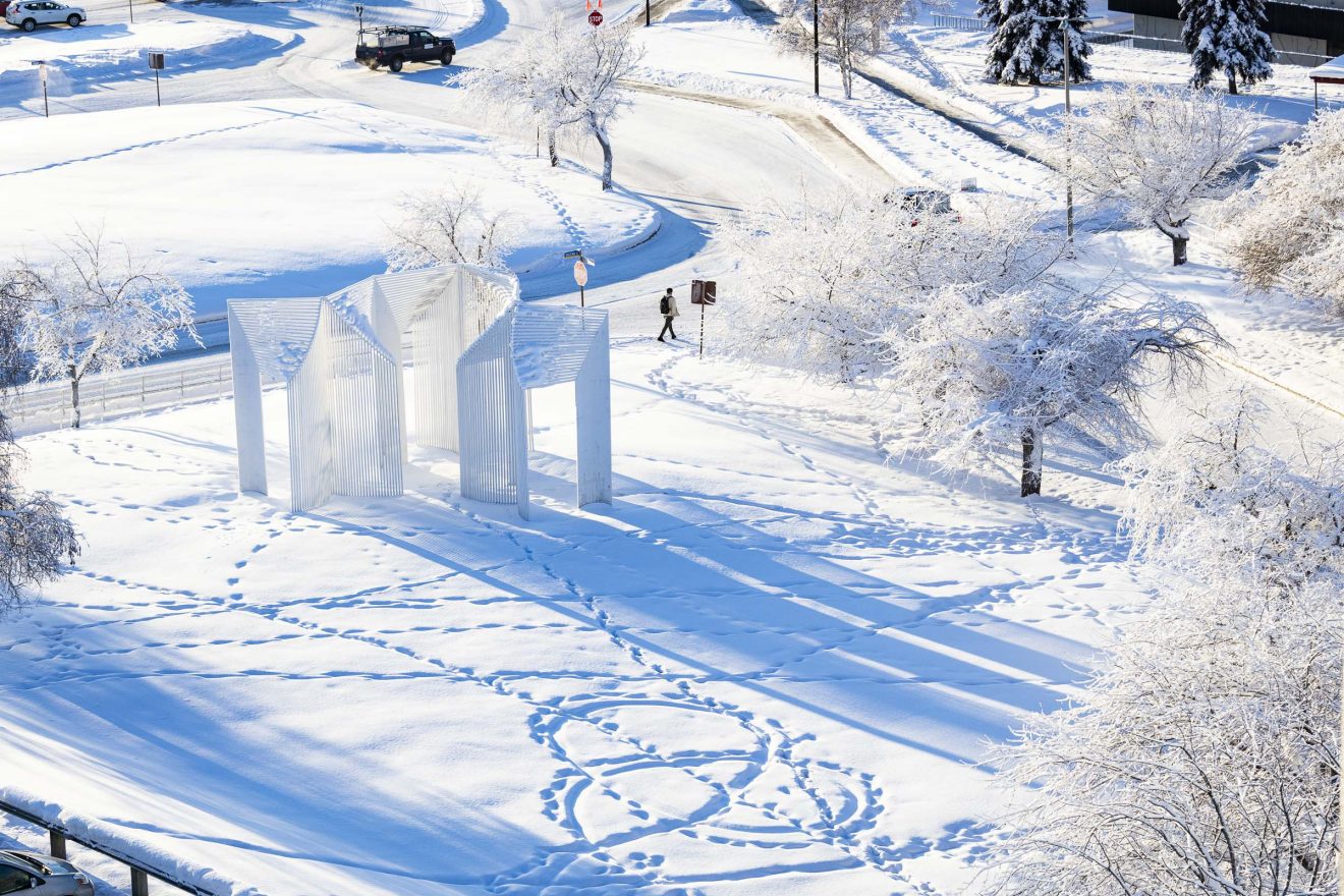 Footprints are scattered near the Elysian sculpture on the Fairbanks campus.