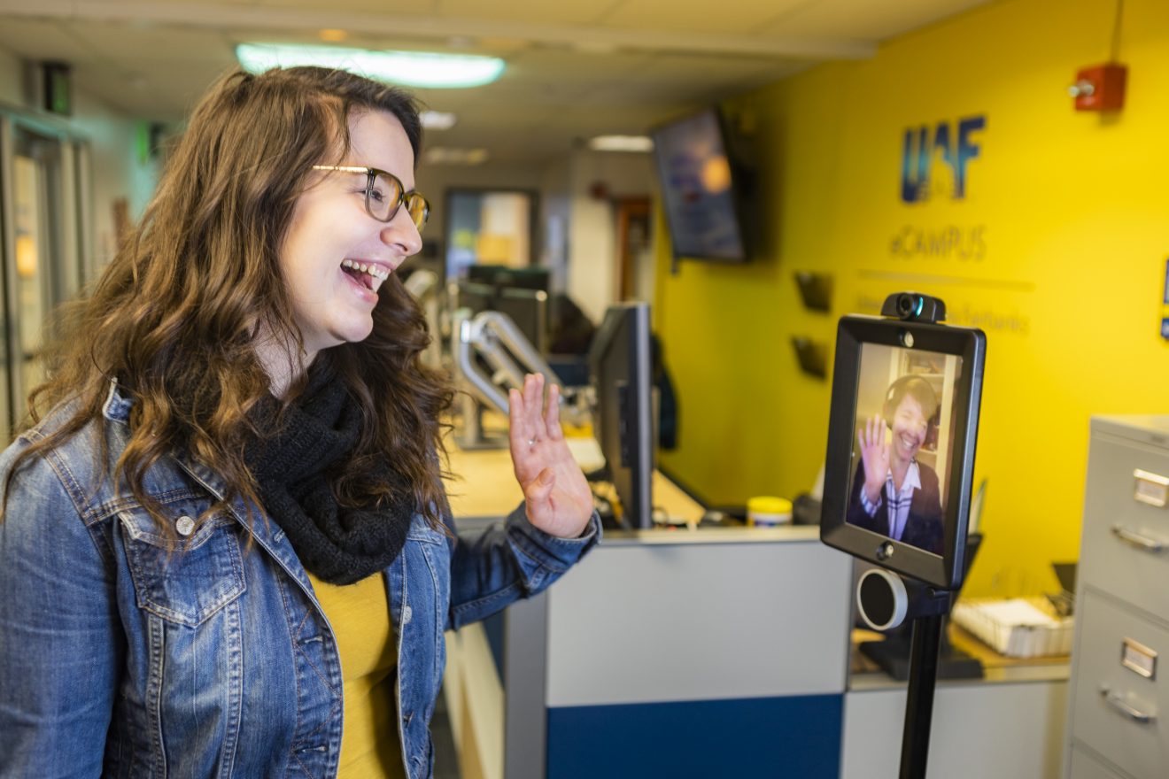 Faith Fleagle, UAF eCampus Career Coach, meeting with someone on the Double robot.