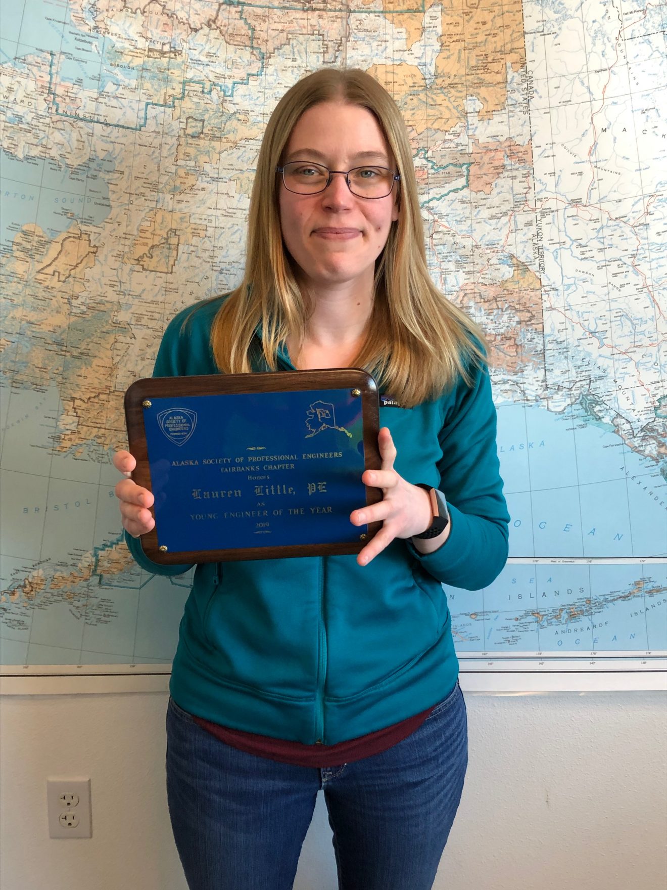 Lauren Little photo holding award