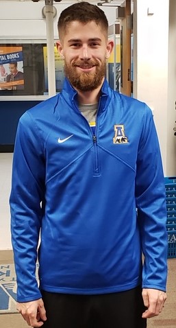 Man wearing Nike shirt with A-bear logo