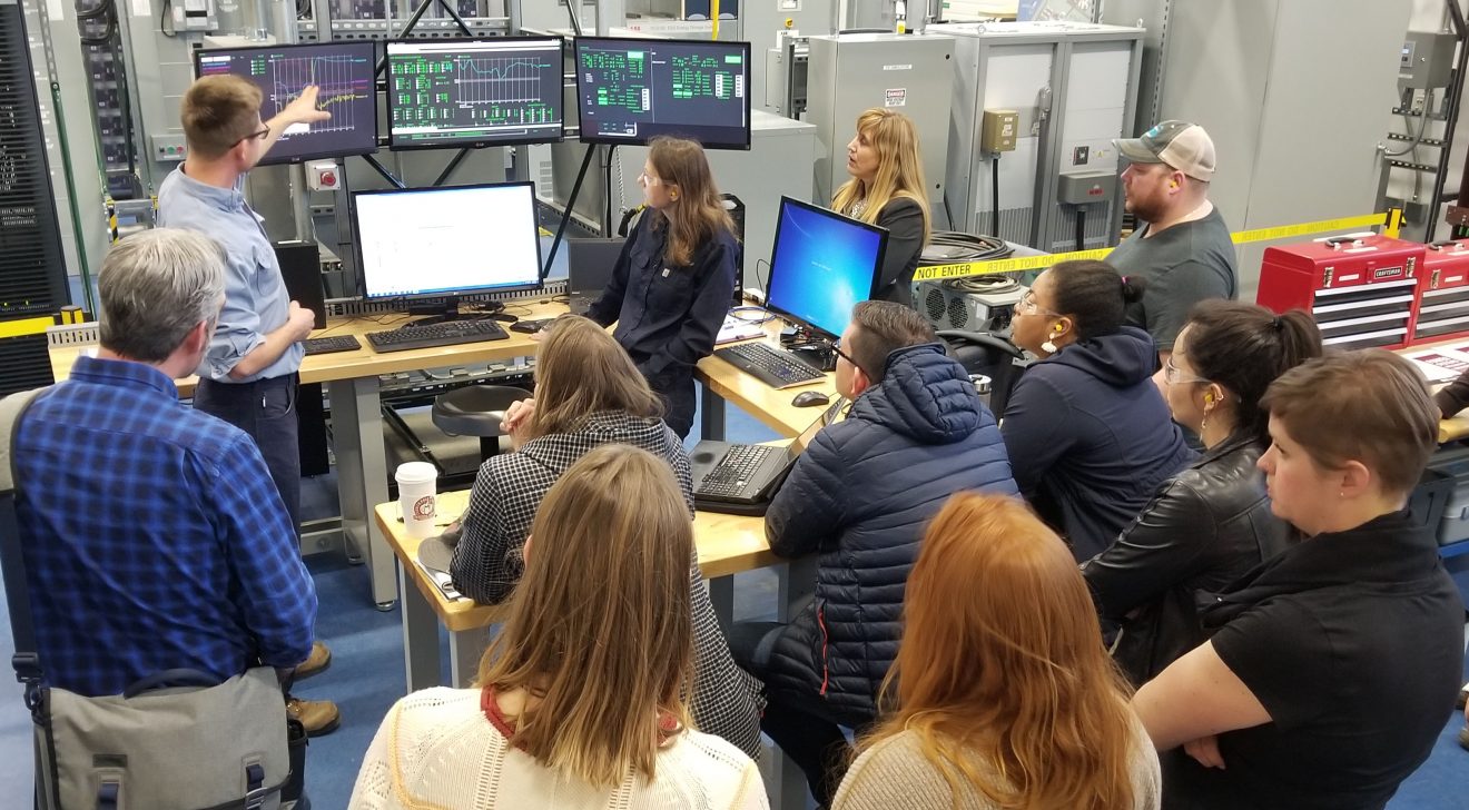 ACEP's Jeremy Vandermeer leads a live demonstration of solar and wind energy integrating with the diesel generator in the Power Systems Integration Lab. Photo by Amanda Byrd.