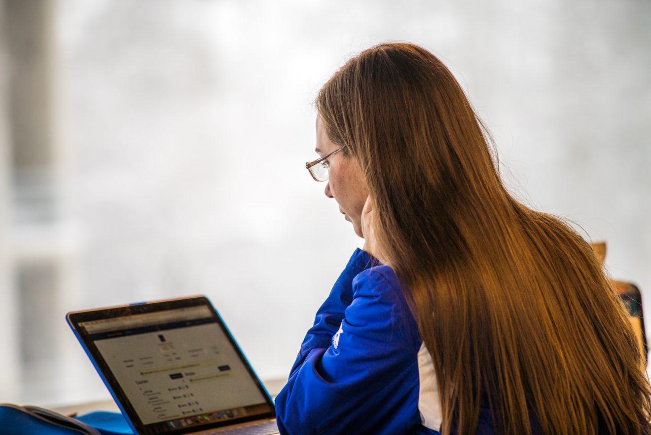 woman sitting in front of laptop