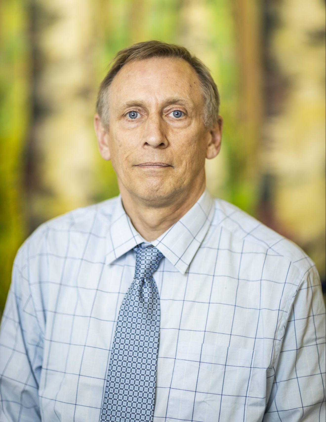 Studio head shot of Doug Reynolds.