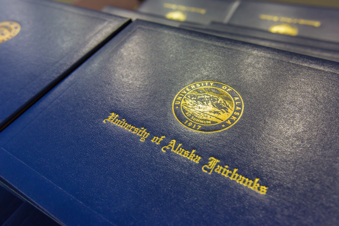 close-up of a UAF diploma cover