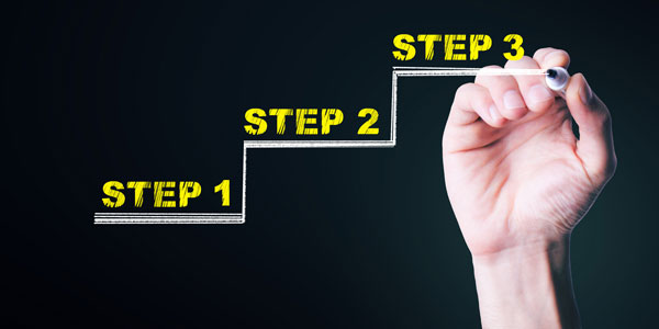 A hand drawing stair steps.