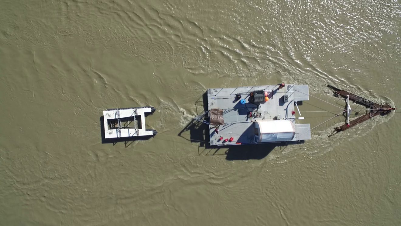 Photo by Paul Duvoy. An aerial view shows a hydrokinetic turbine test site at the Alaska Center for Energy and Power's Tanana River test site near Nenana in July 2020.