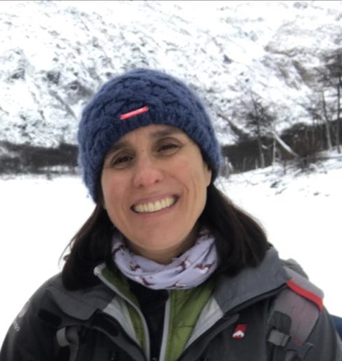 Head shot of a woman outside.