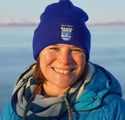 Head shot of a woman outside.