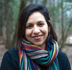 Head shot of a woman outside.
