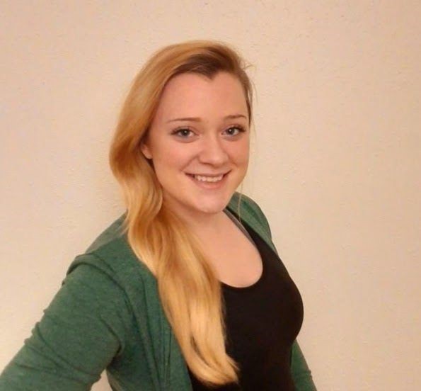 Head shot of a woman inside.