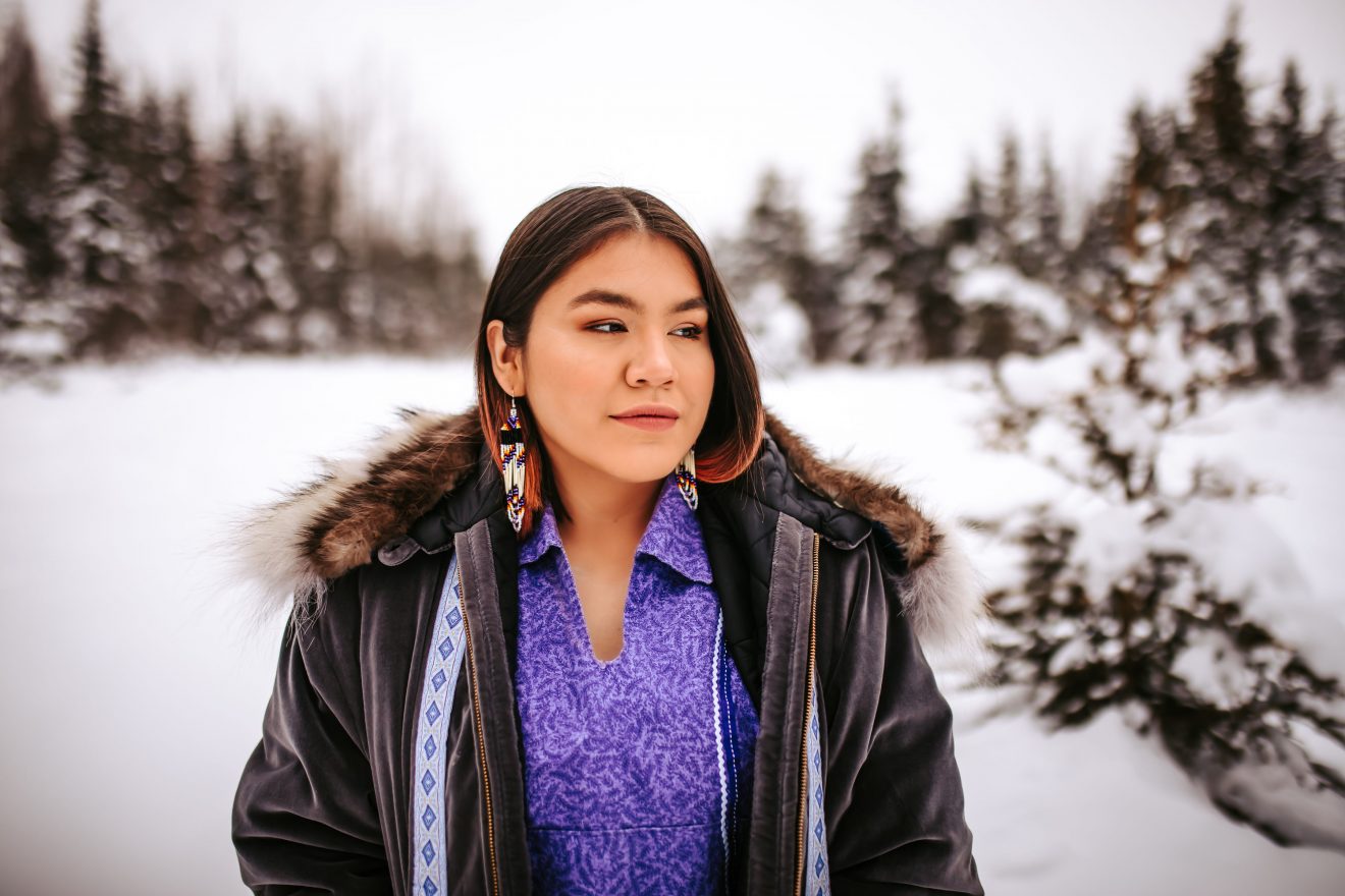 Head shot of a woman outside.