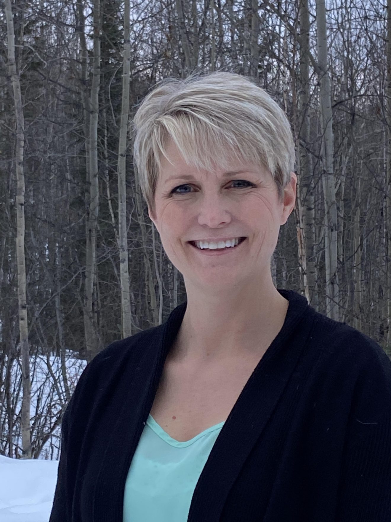Head shot of a woman standing outside in winter.