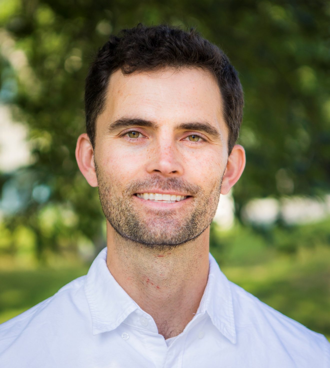 Head shot of a man outside