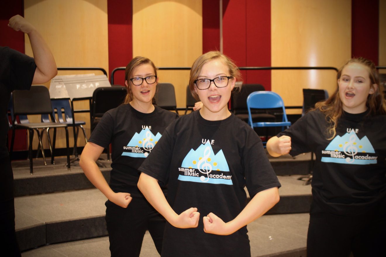 three children singing