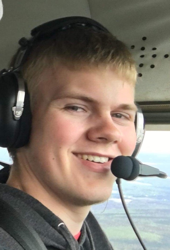 Man sitting in a plane with headset