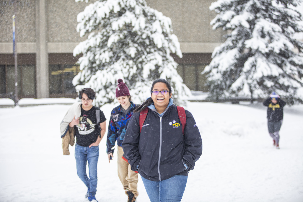 A snowstorm brought smiles to the face of students making their way across campus in November 2019.