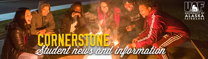 Students outside the MBS complex around a firepit enjoying conversation and smores..