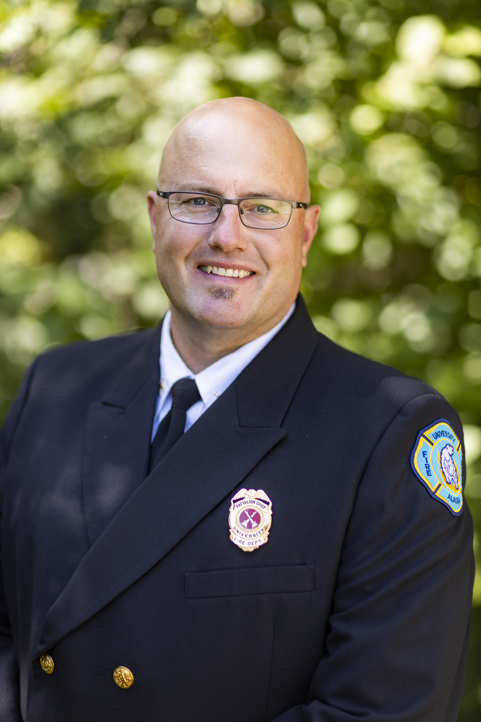 Chief Schrage in front of fire apparatus