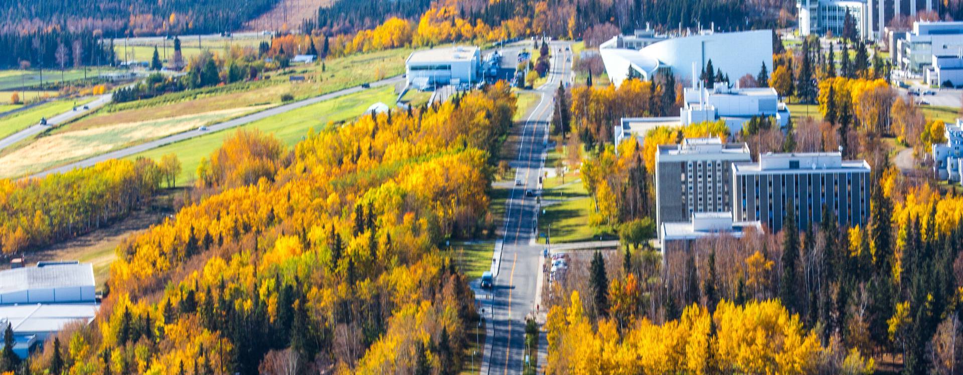 West-facing aerial view of UAF Troth Yeddha campus in Fairbanks in autumn.