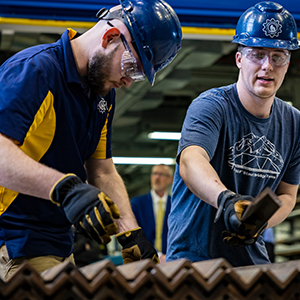UAF College of Engineering and Mines students compete in the 2022 Steel Bridge Competition at the ELIF Building High Bay. UAF Photo by Leif Van Cise