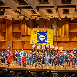 The first day of the Festival of Native Arts takes place in the Great Hall. Guests, mentors, performers and families come together to enjoy the momentus weekend on the Troth Yeddha' Campus with live music, dancing and vendor tables, February 27, 2025. UAF photo by Leif Van Cise