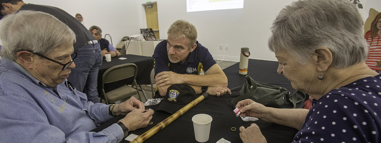 At the 2022 Nanook Rendezvous alumni reunion, Paul Hunter ’62 and his wife, Birgit, work with Bill Schnabel, College of Engineering and Mines dean, on a project inspired by the MIX, a creative collaboration of faculty and staff.