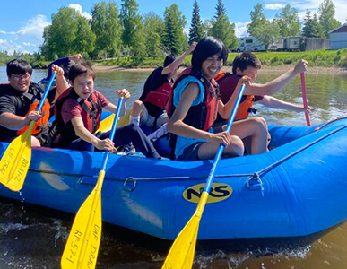 Fairbanks youth paddle down a river