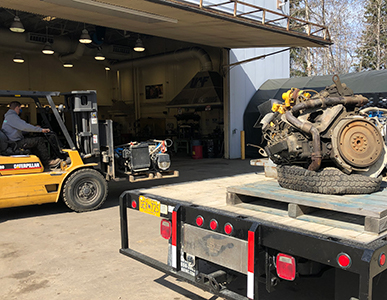Image of a fork lift moving auto supplies