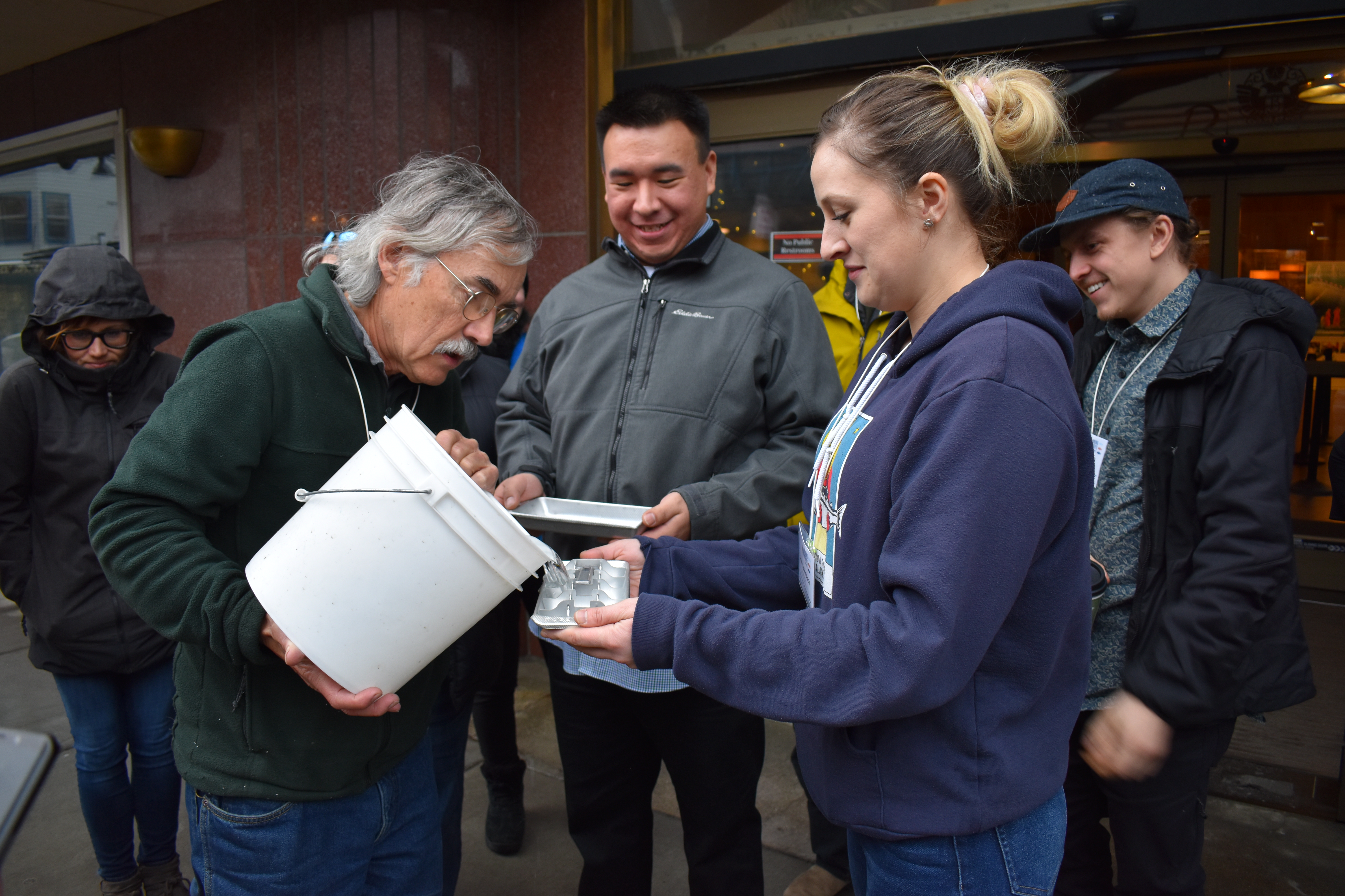 Participants in the Alaska Young Fishermen’s Summit use ice cube trays to learn about the center of gravity and stability in fishing vessels. Photo by Dawn Montano.