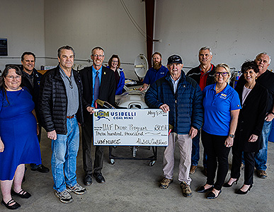 Group of people accepting check