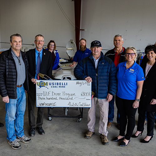 Members and Executives of Usibelli Coal Mine tour the ACUASI Hanger located on East Ramp in Fairbanks Alaska, 5/5/22. UAF photo by Leif Van Cise.