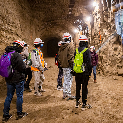 GeoFORCE students explore the CRREL Permafrost Tunnel. UAF photo by Leif Van Cise.