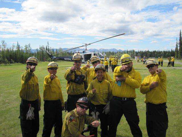 Wildland Fire Students pose for the camera in helmets