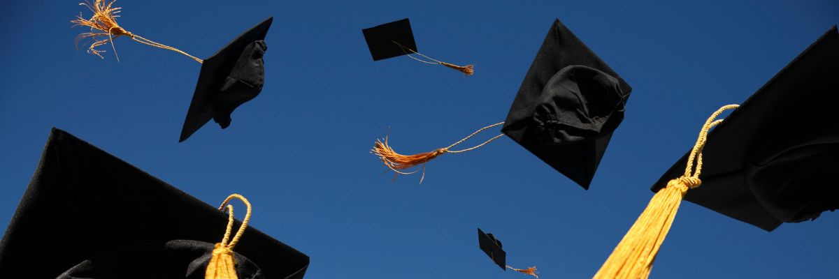 Graduation caps tossed in the sky as celebration