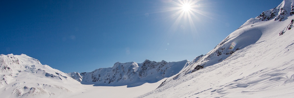 sunny snowy mountain slope