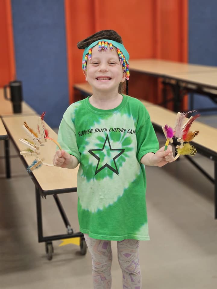 Youth holding crafts