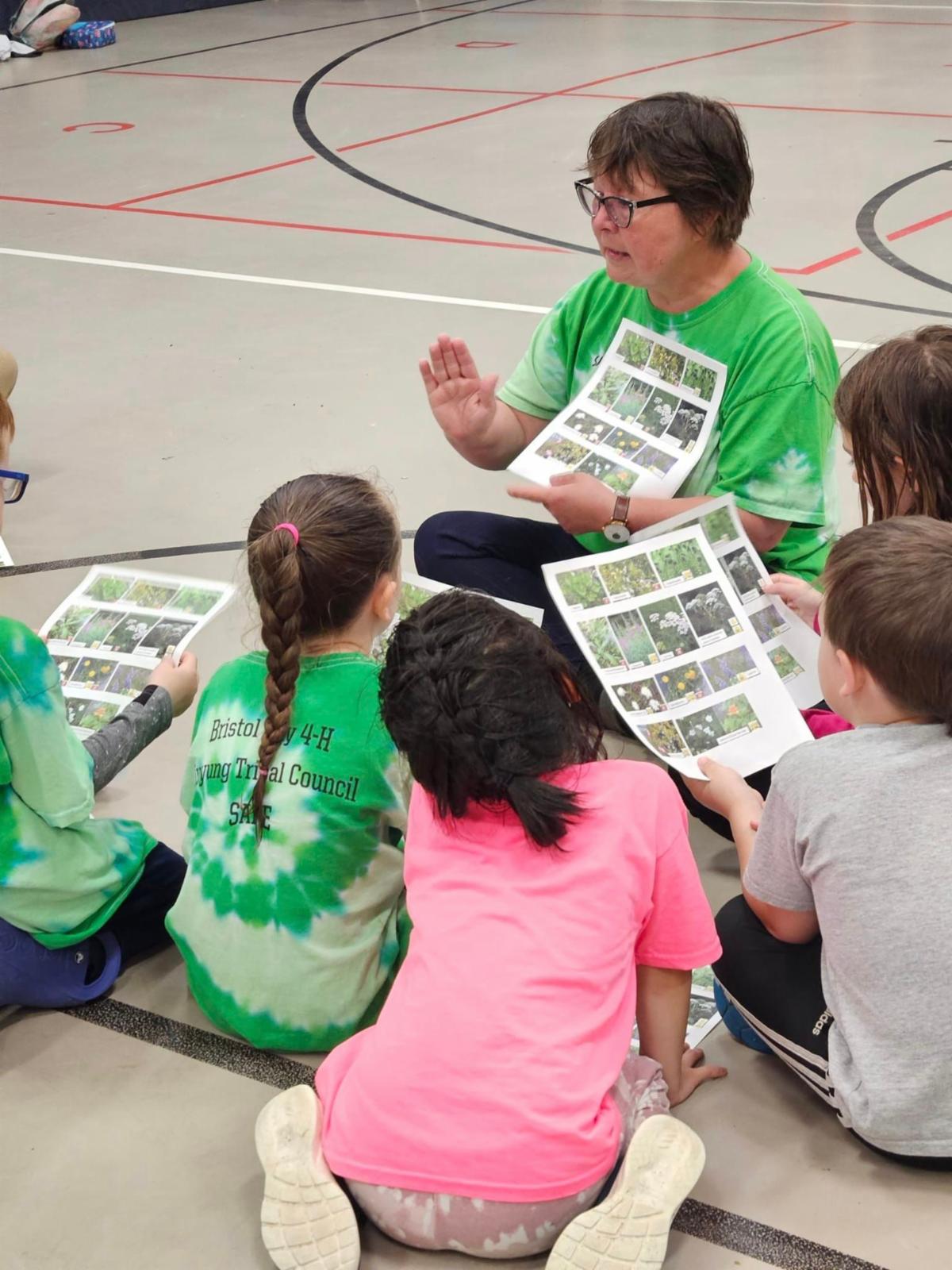 Youth sitting and listening to teacher