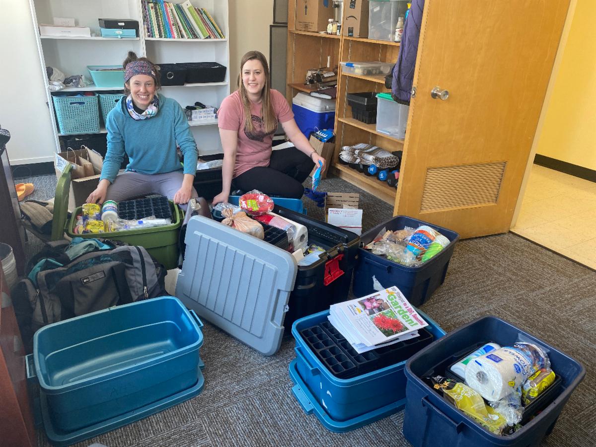 Two women packing for trip