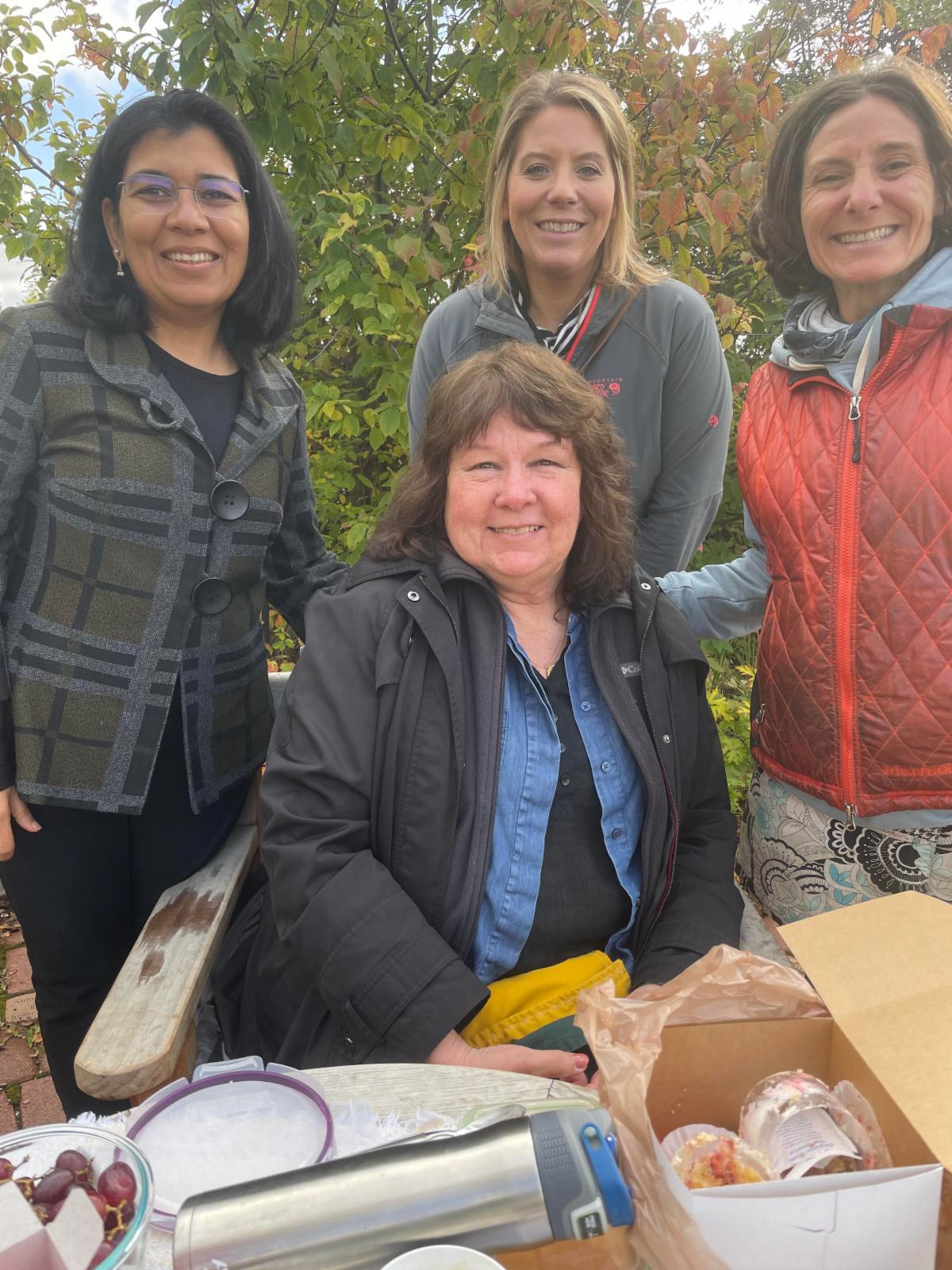  Four women gathered at a table