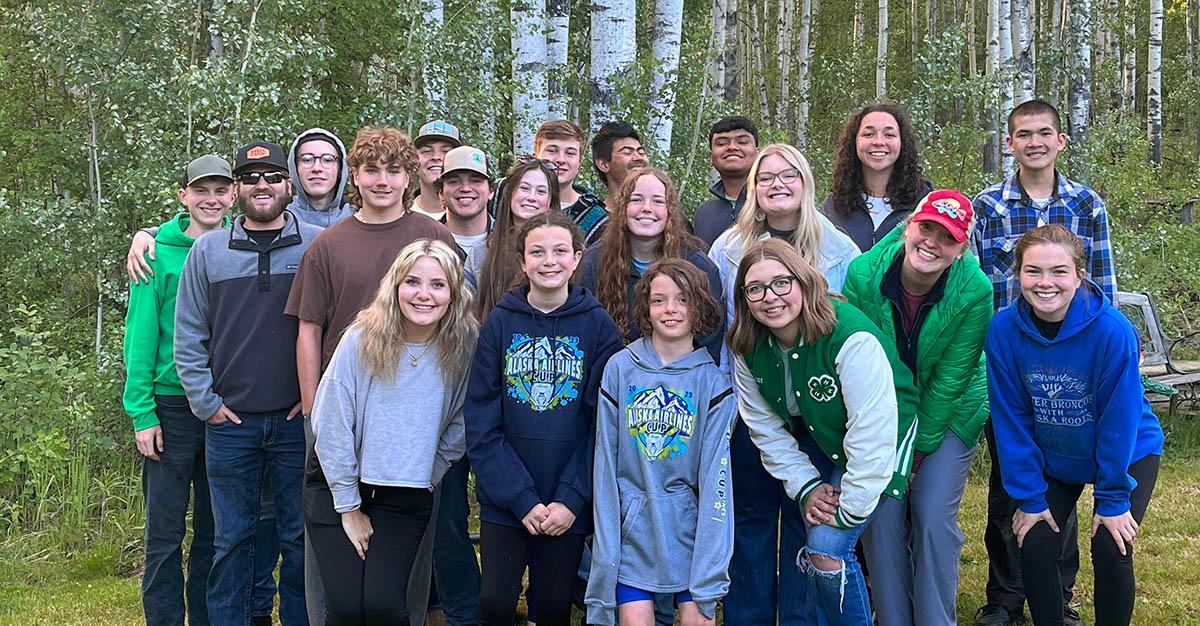 Group of individuals posing for photo