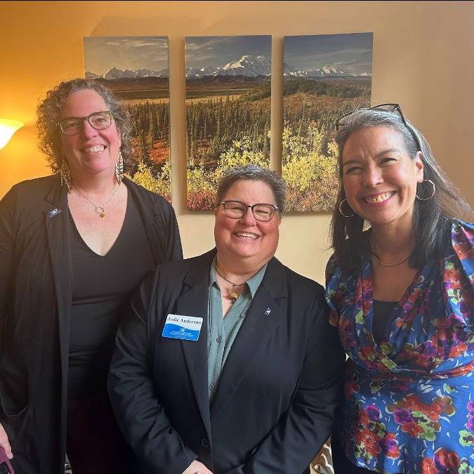 Three women smiling for photo