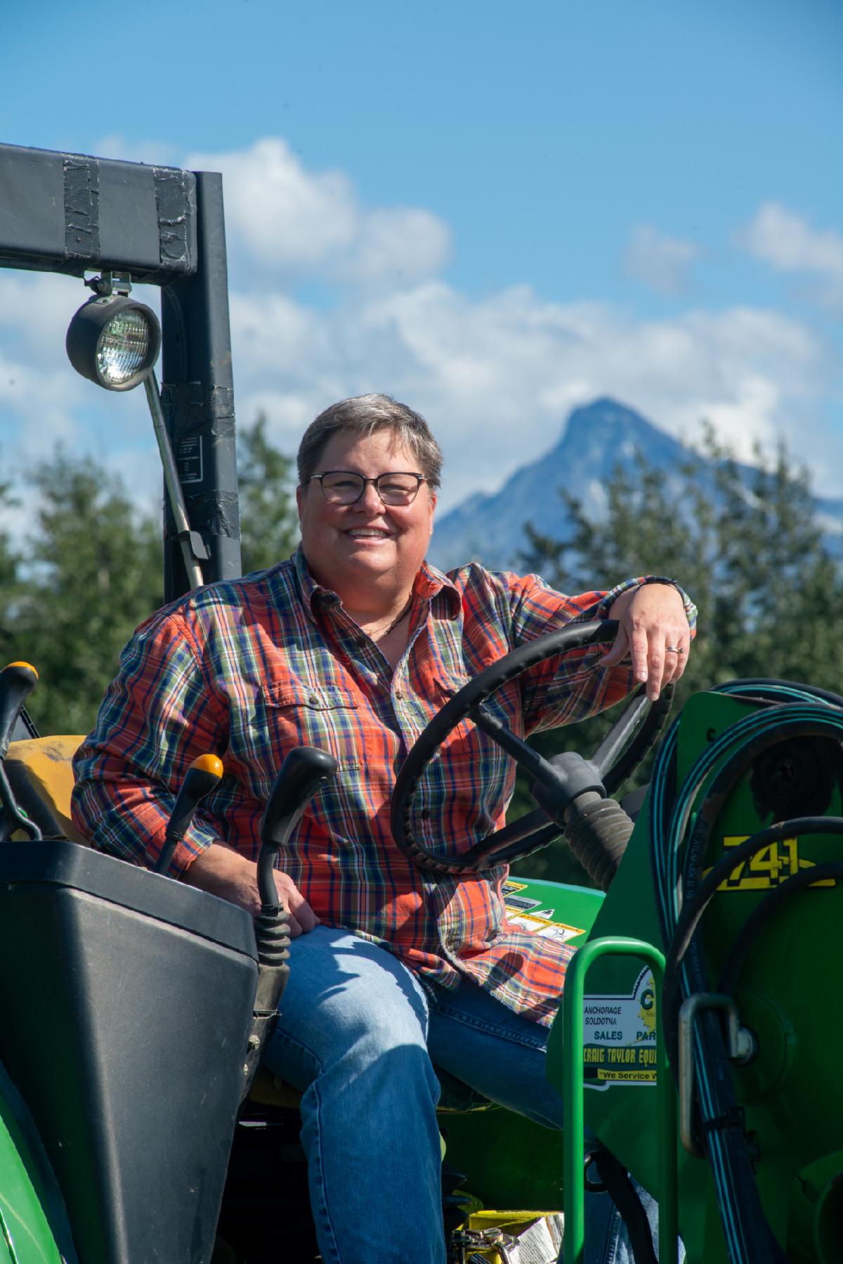 Woman driving a tractor
