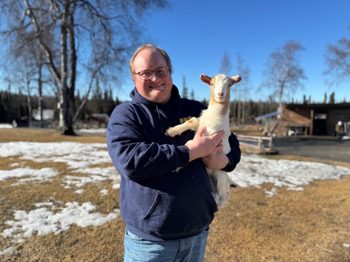Jim Vinyard holding a goat