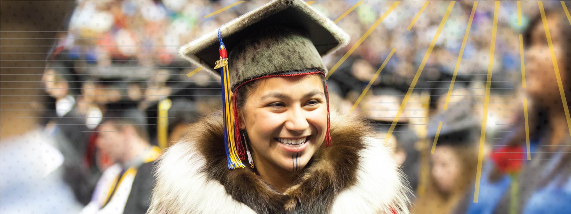 Marjorie Tahbone prepares to walk across the commencement stage after earning her degree in Alaska Native studies in 2013