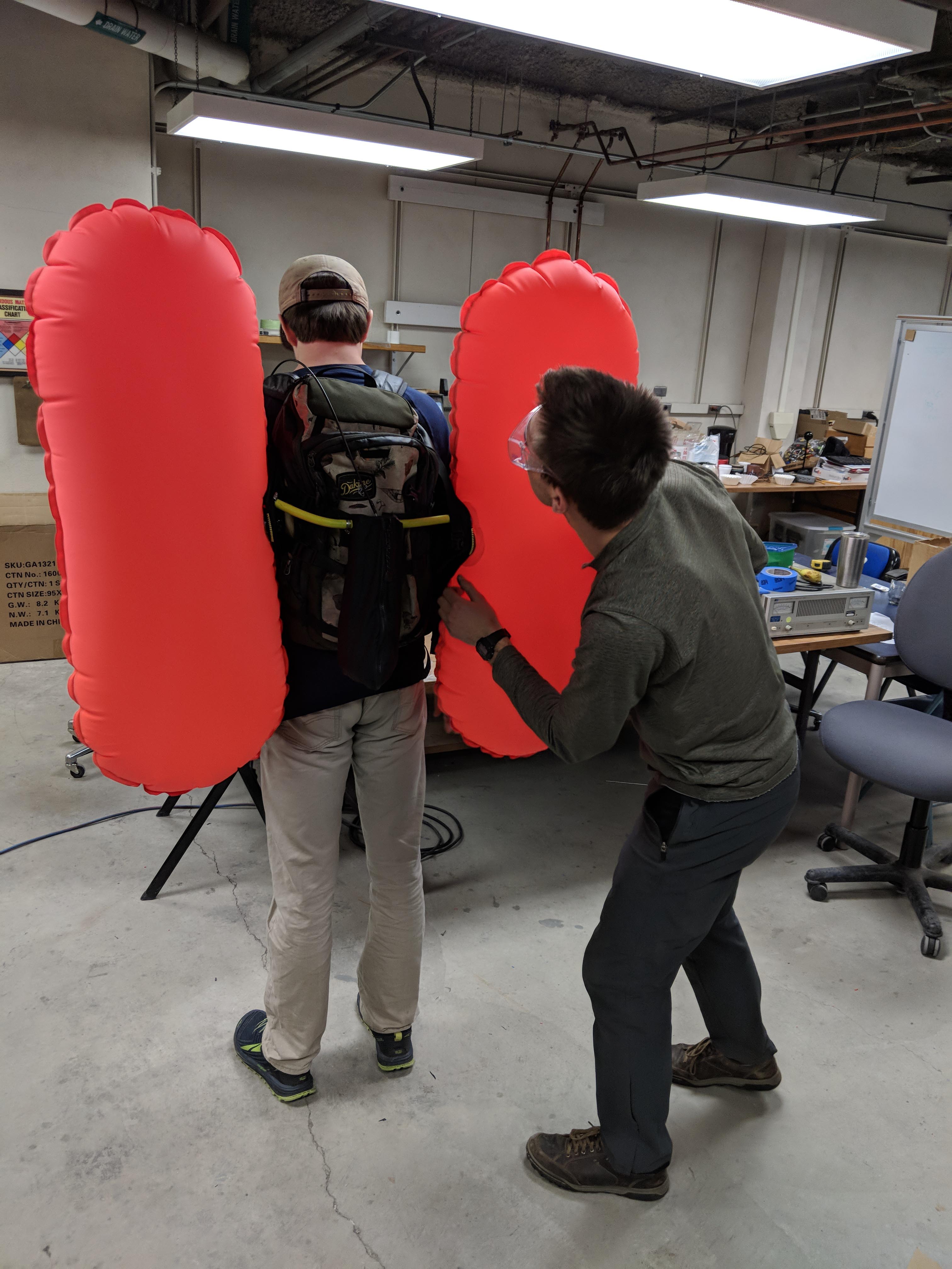 UAF mechanical engineering students test the Avy Pouch during product development.