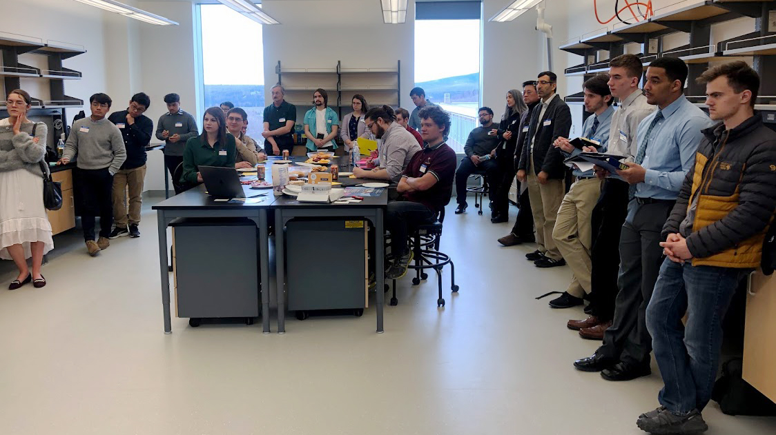 Students watch a pitch by a startup company before starting interviews. Photo by Kernell Snow.