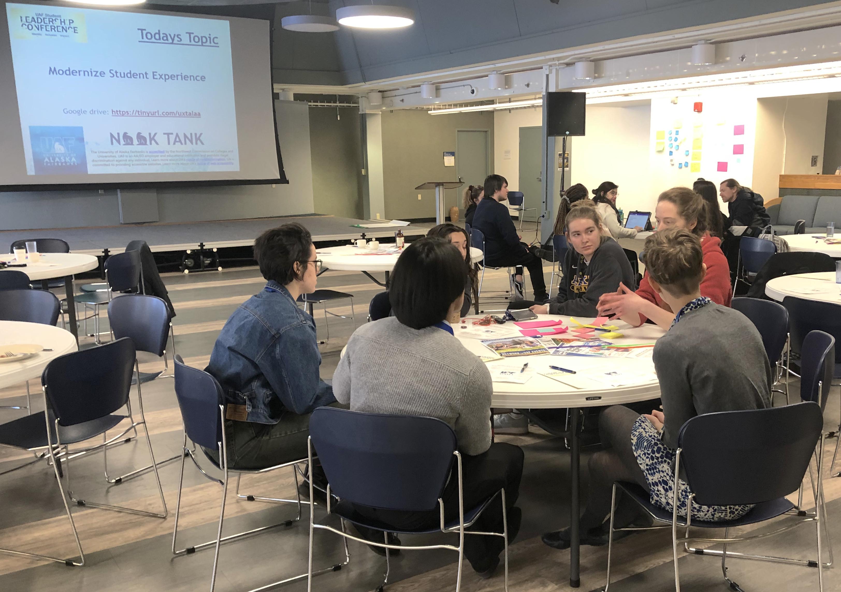 Student Leadership Conference organizers talk to Team Intel about their solution to specific needs on providing a modern UAF during the Nook Tank event. Photo by Peter Webley.