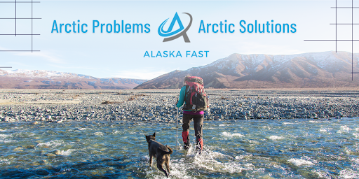 A researcher forges through a river in the field