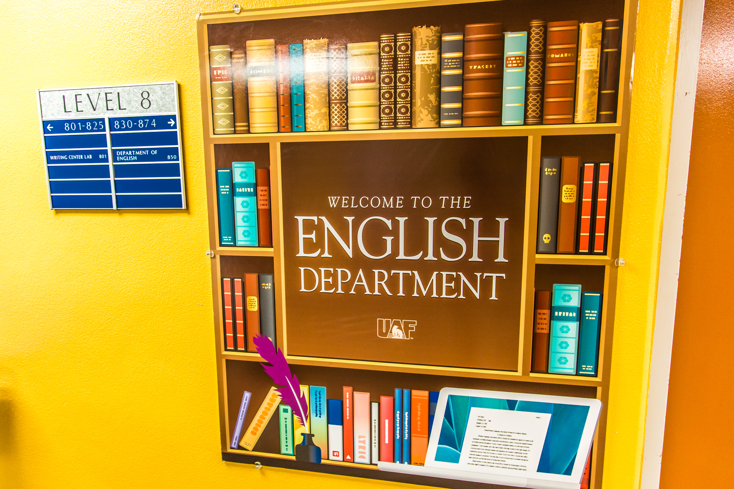 Bookcase with plaque saying Welcome to the English Department.